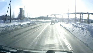 russia-dashboard-cam-tank-drives-across-road-snow-1359329911C